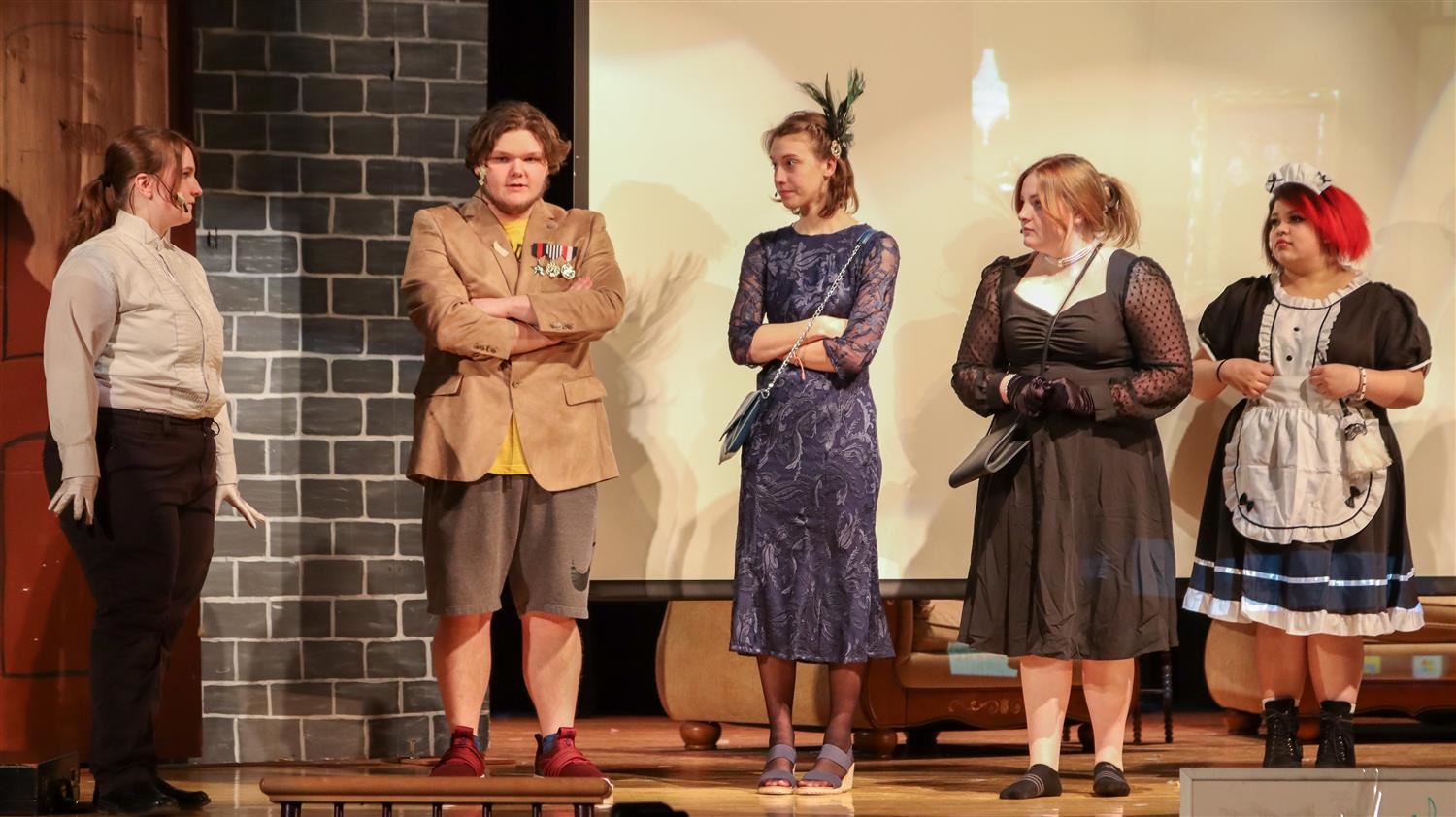  1.	Hannibal students perform a scene from “Clue: On Stage,” which took place recently during a two-