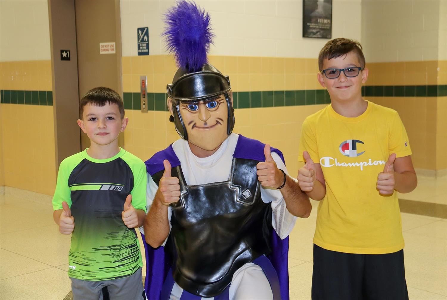  The Warrior mascot joins two Hannibal students to give the “thumbs up” to the start of the year.