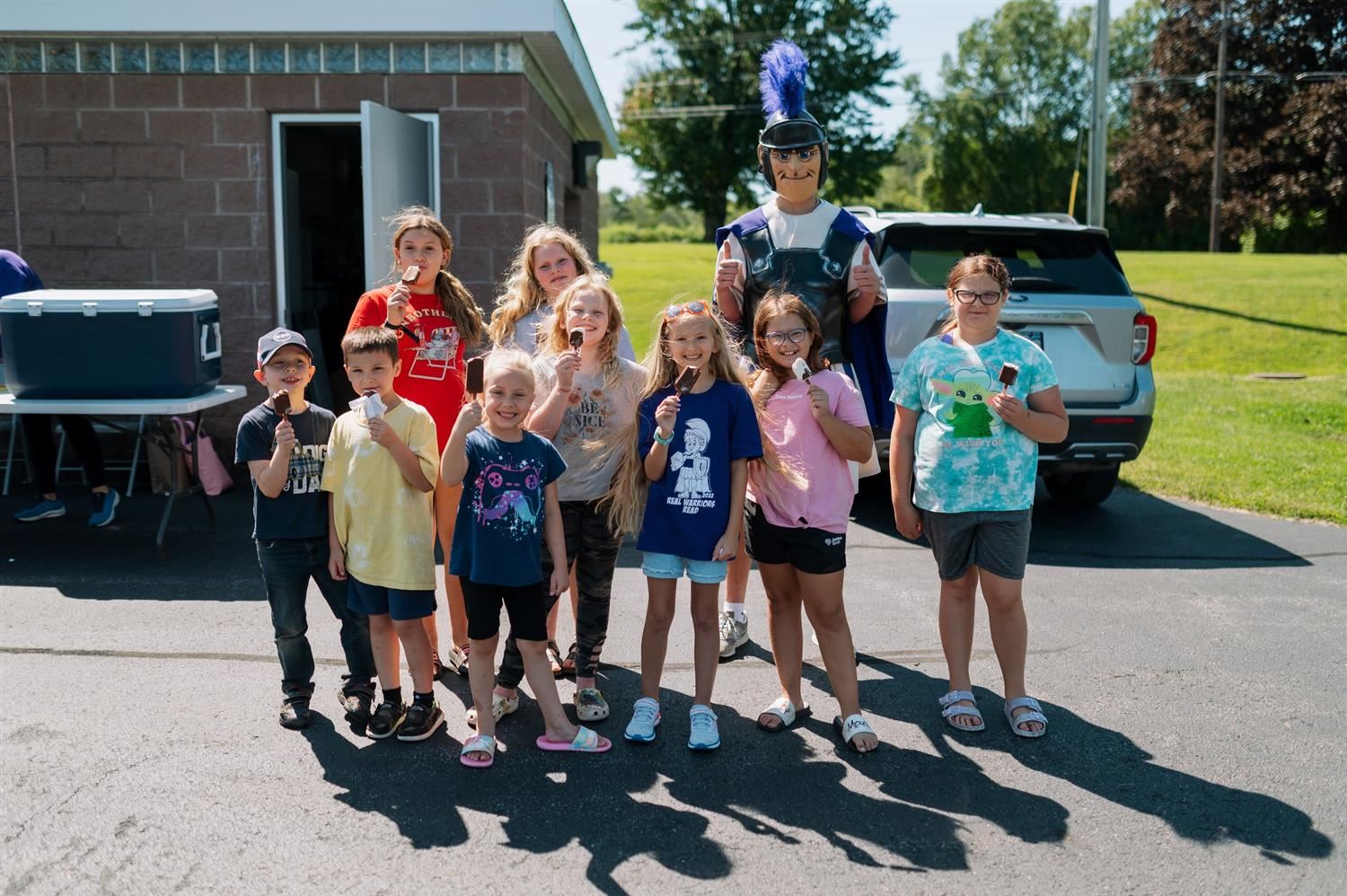  Students at Hannibal celebrate the start of a new school year with the Warrior mascot and ice cream