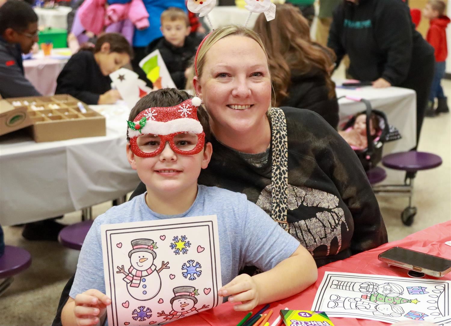  A Fairley student shows off the colorful drawing he created