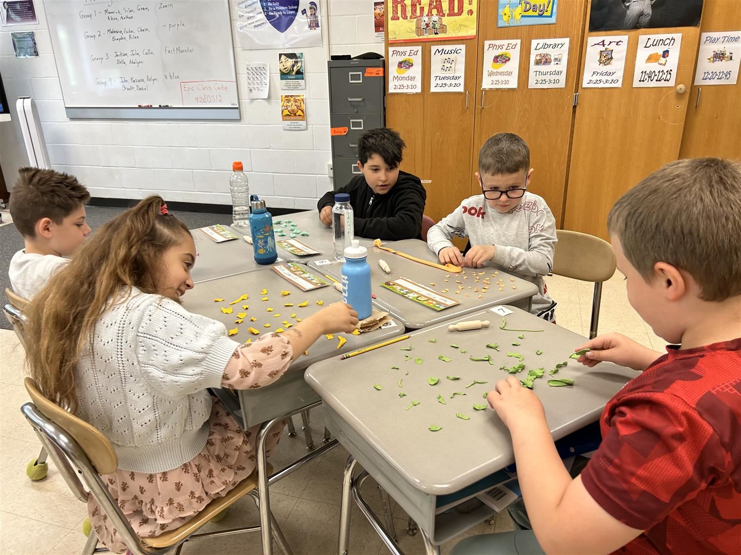 Fairley Elementary students use Play-Doh to simulate different processes used at Novelis.