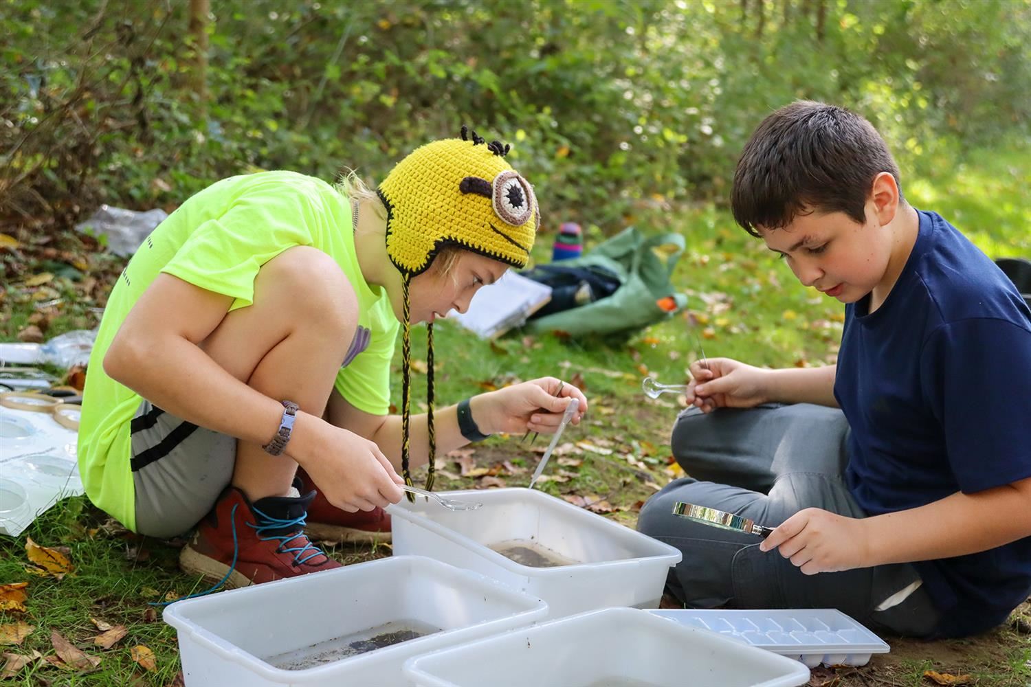  DMK students examine water samples for microorganisms during a recent field trip to Rice Creek Fiel