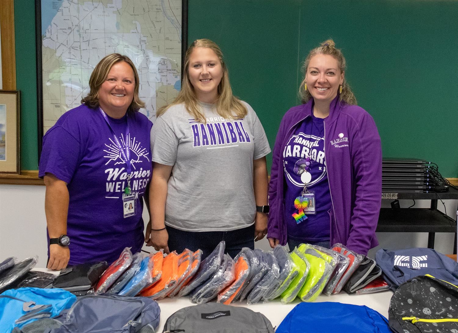 Members of the HFA prepare to give away some of the 120 backpacks at stuff-a-bus distribution.