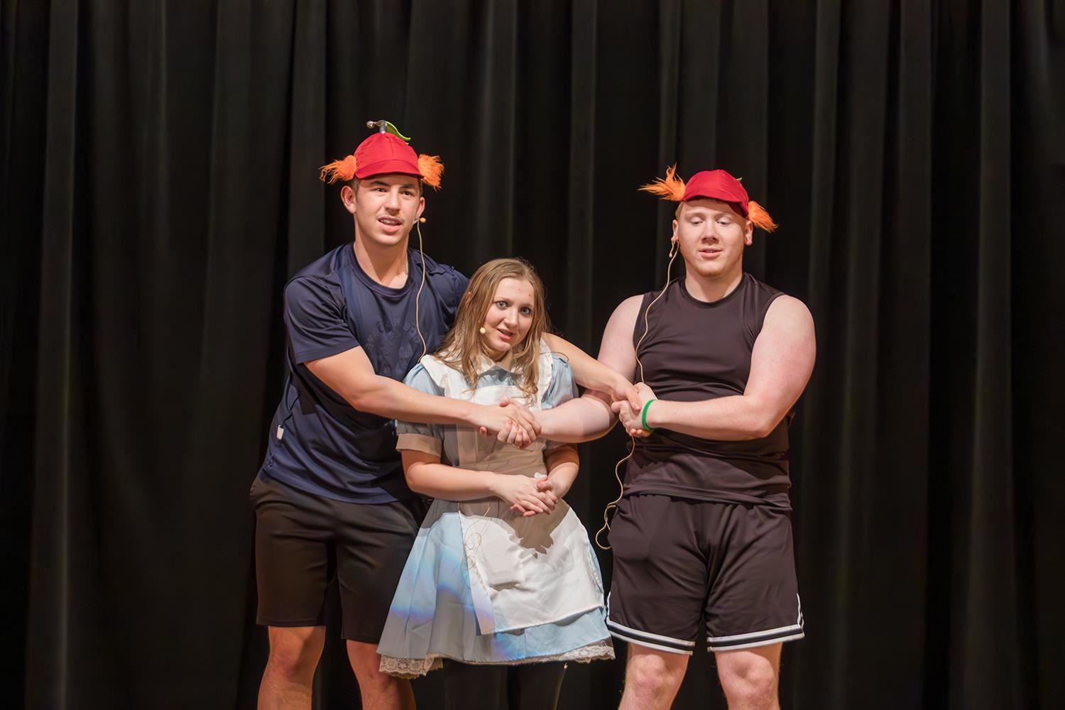  Hannibal High School students portray Tweedle Dee, Tweedle Dum and Alice during dress rehearsals 