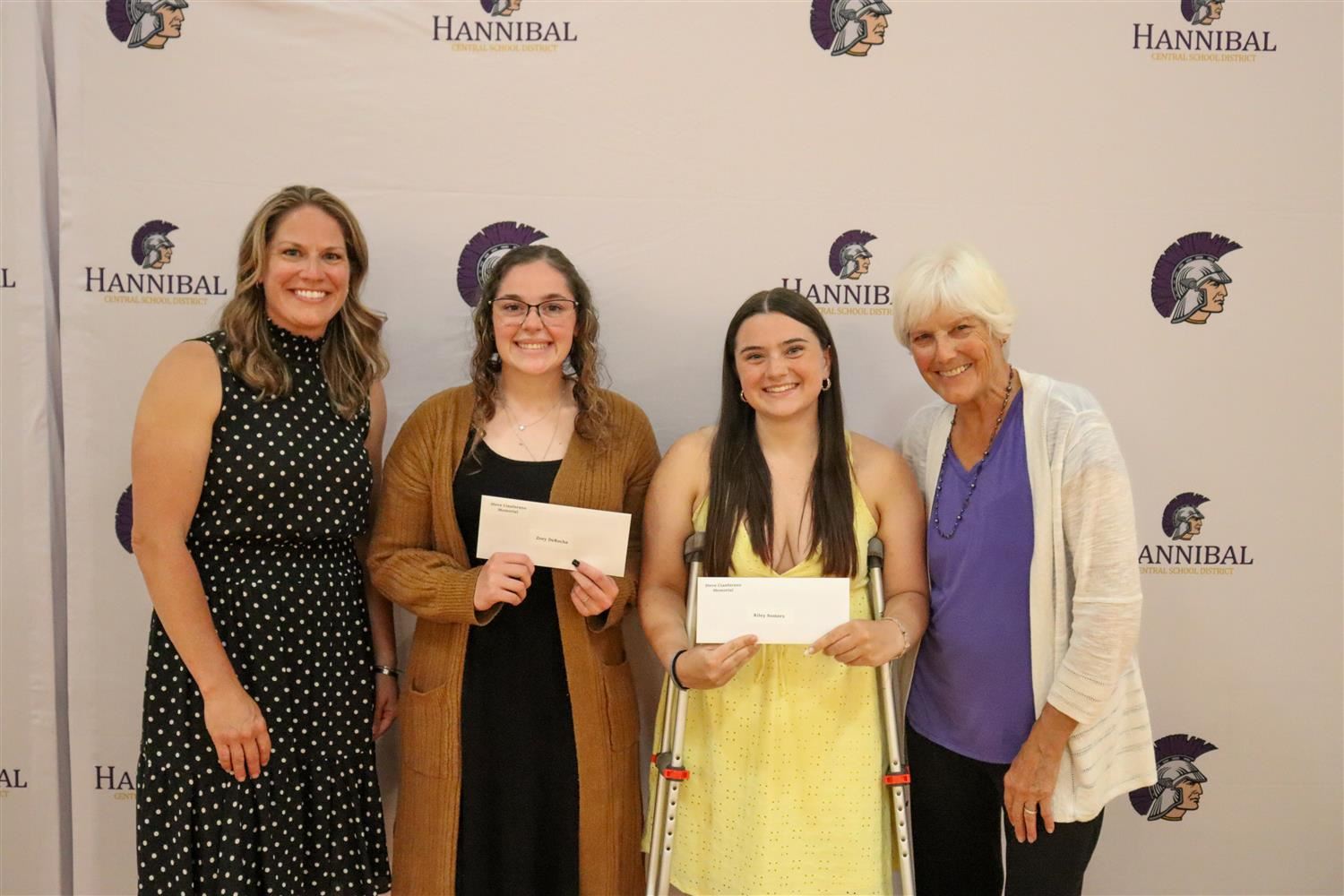  zoey DeRocha and Riley Somers accept the Steve Cianfarano Memorial Scholarship.