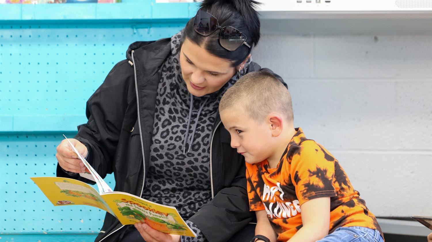  A Hannibal first-grader enjoys a book during the All Hallows’ Read event. 